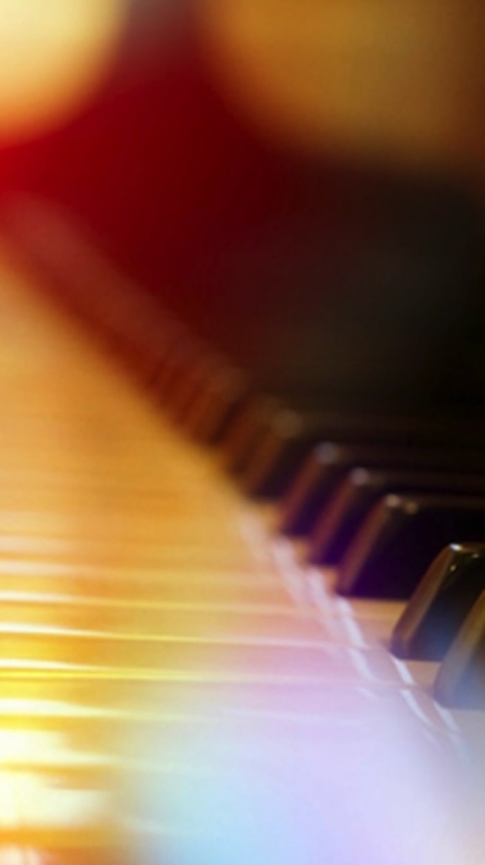 Warmly lit piano keyboard